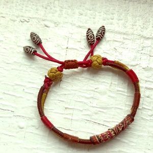 Woven bracelet with beads